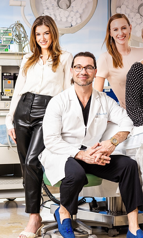 Medical team posing in a clinic setting.