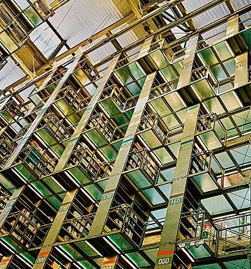 Modern library interior with stacked bookshelves.