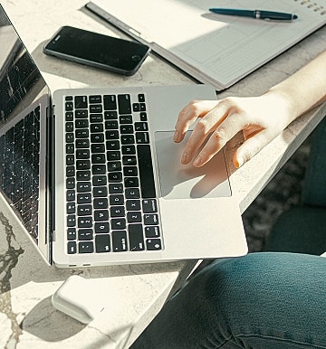 Person using laptop on a desk