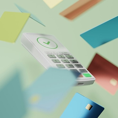 Mobile phone surrounded by colorful cards.