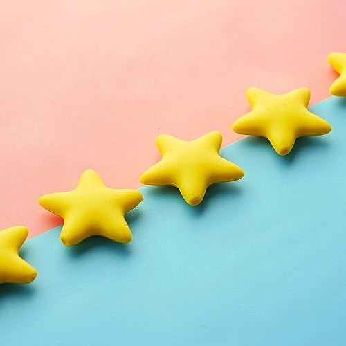 Yellow star shapes on pink and blue background