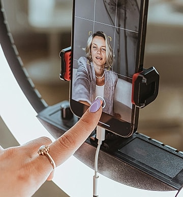 Person taking a selfie with a smartphone.
